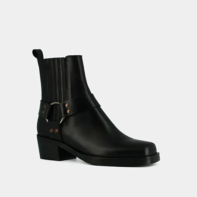 Ankle boots with buckles in black greased leather